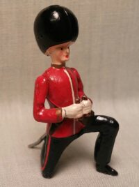 British Guards officer, kneeling with binoculars